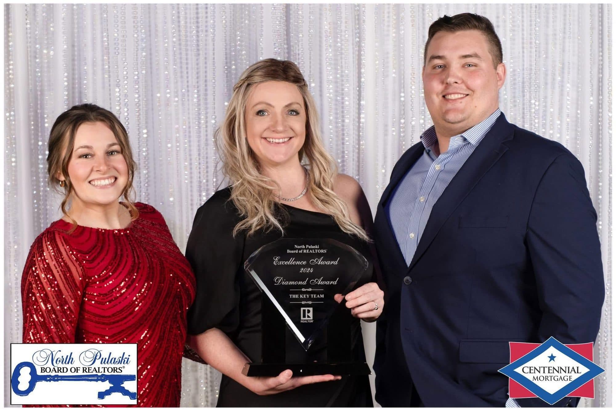 Nick Priest, Mindy Strand, and Claudia Johnson accepting a North Pulaski Board of REALTORS Excellence Award and Diamond Award for The Key Team